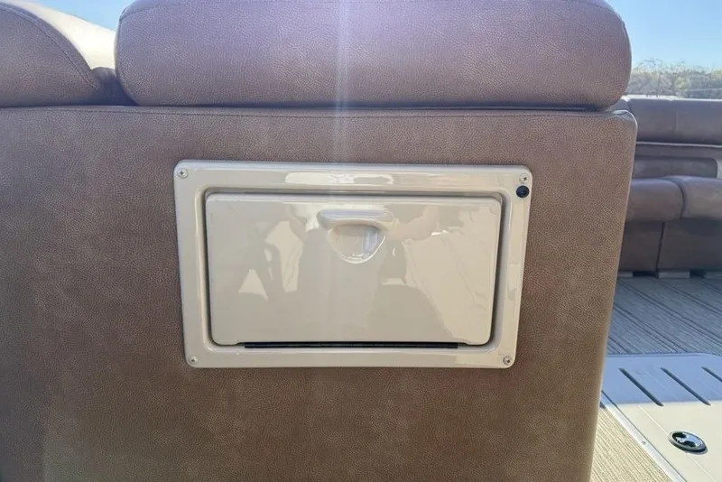 Slide: The Image of Rear seating compartment of 2026 Premier 330 Escalante boat, featuring a storage hatch. - 24