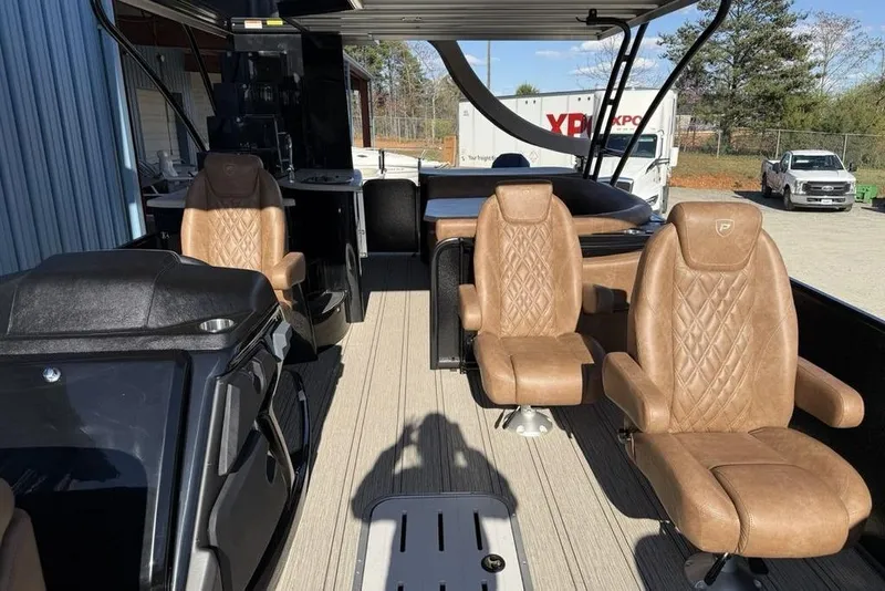 Slide: The Image of Luxurious interior of 2026 Premier 330 Escalante boat with plush seating and modern design. - 28