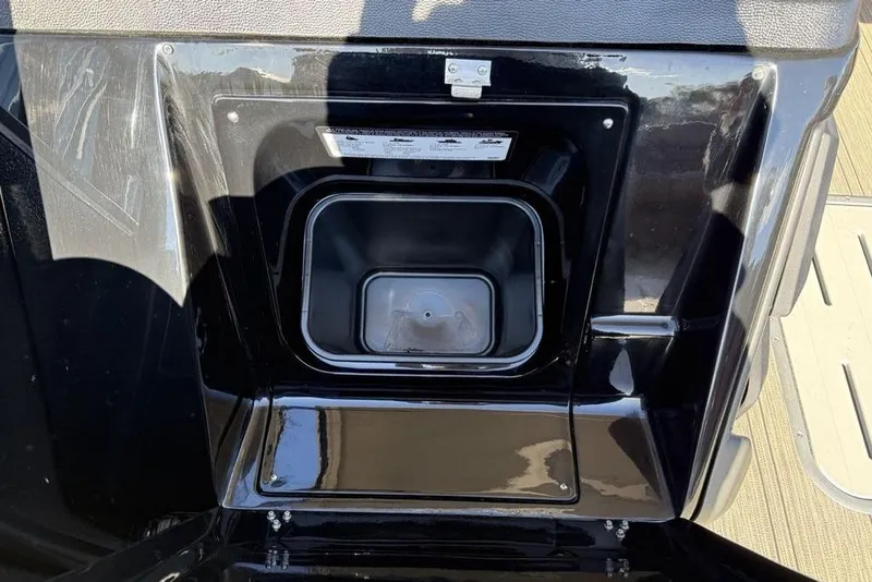 Slide: The Image of 2026 Premier 330 Escalante storage compartment with black finish and secure latch. - 29