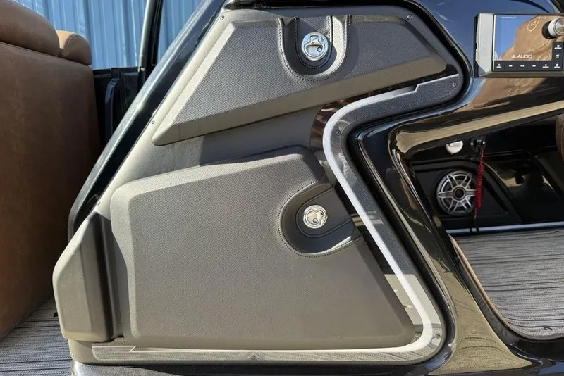 Slide: The Image of Interior detail of 2026 Premier 330 Escalante, featuring sleek design and modern audio system. - 32