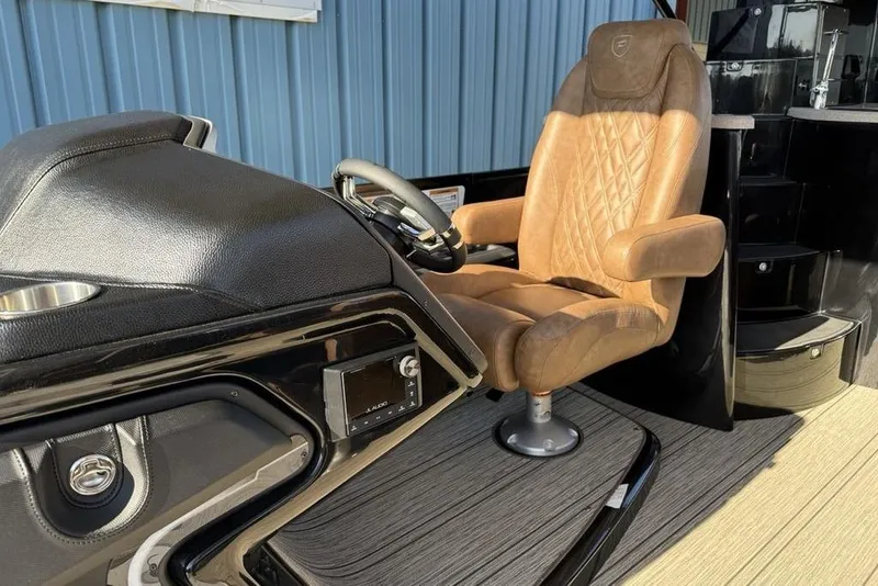 Slide: The Image of Luxurious captain's chair in 2026 Premier 330 Escalante boat cockpit, featuring sleek design. - 39