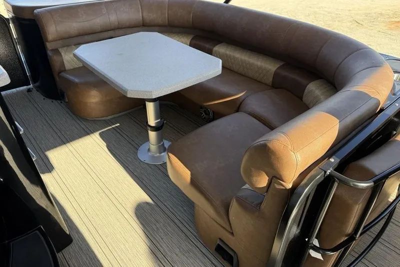Slide: The Image of Luxurious seating area on 2026 Premier 330 Escalante boat with brown leather upholstery. - 40