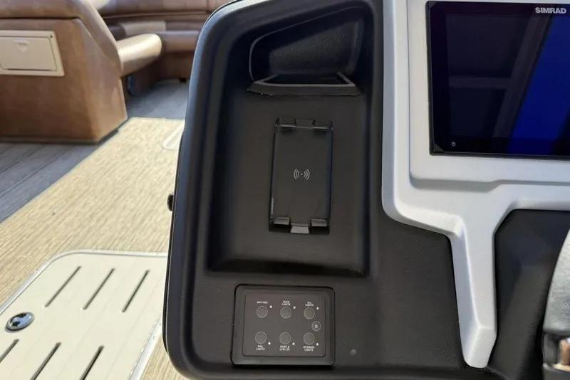 Slide: The Image of 2026 Premier 330 Escalante dashboard with wireless charging pad and control panel. - 41