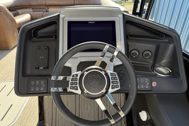 Slide: The Image of Steering console of 2026 Premier 330 Escalante boat with modern controls and display. - 45