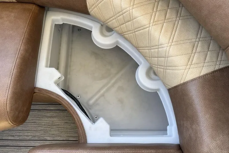 Slide: The Image of Interior storage compartment of 2026 Premier 330 Escalante with brown and beige seating. - 47