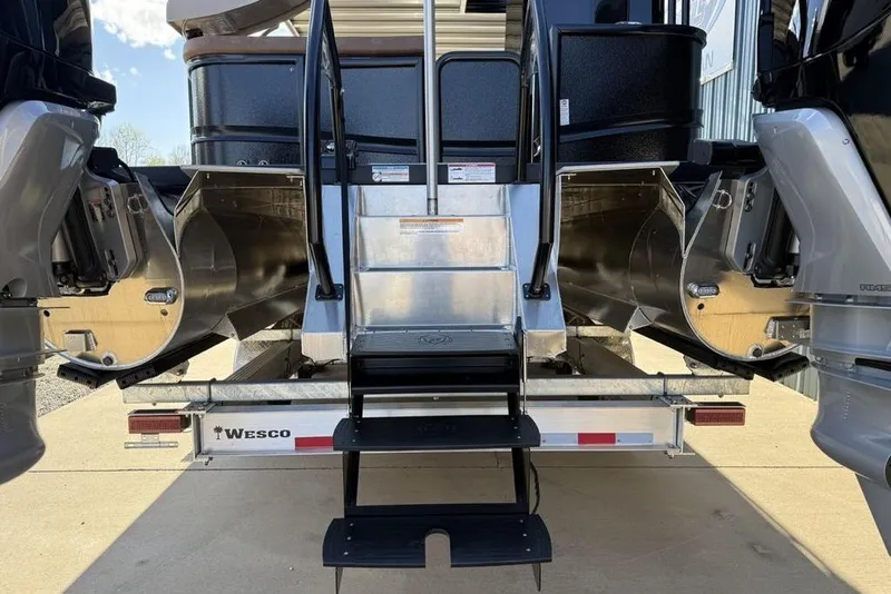 Slide: The Image of Rear view of 2026 Premier 330 Escalante boat with steps and dual engines. - 5