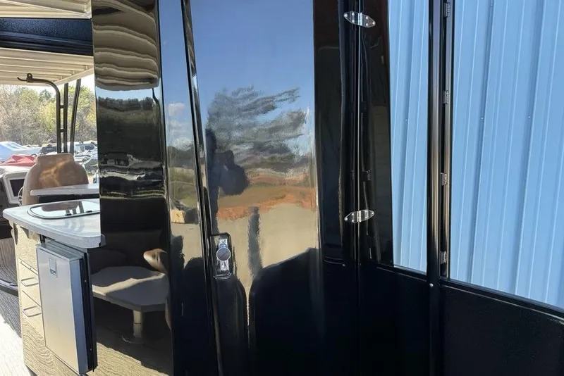 Slide: The Image of 2026 Premier 330 Escalante interior with sleek black finish and modern amenities. - 59