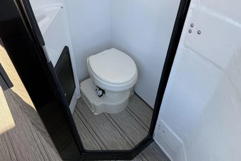 Slide: The Image of Compact bathroom in 2026 Premier 330 Escalante with modern toilet and sleek design. - 61