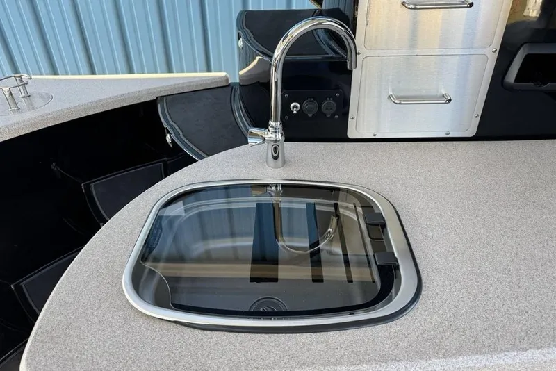 Slide: The Image of Modern kitchen sink and faucet on 2026 Premier 330 Escalante boat. - 66