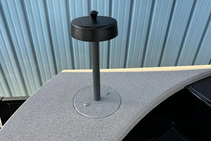 Slide: The Image of Premier 330 Escalante 2026 boat detail with a mounted black cap on a gray surface. - 72