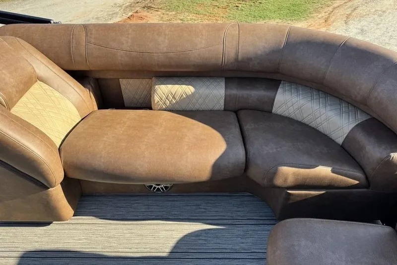 Slide: The Image of Luxurious brown seating in 2026 Premier 330 Escalante boat, featuring elegant diamond stitching. - 74