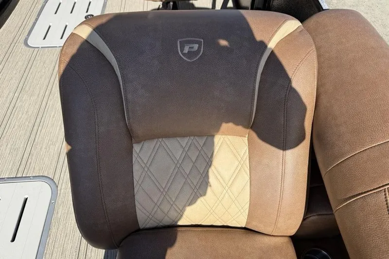 Slide: The Image of Brown leather seat of 2026 Premier 330 Escalante boat with logo and shadow. - 8