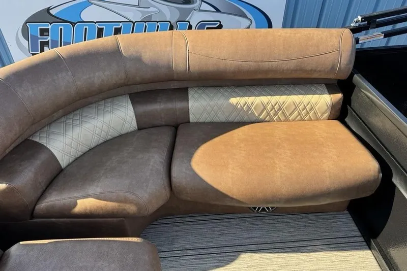 Slide: The Image of Luxurious seating in 2026 Premier 330 Escalante boat, featuring elegant brown upholstery. - 83