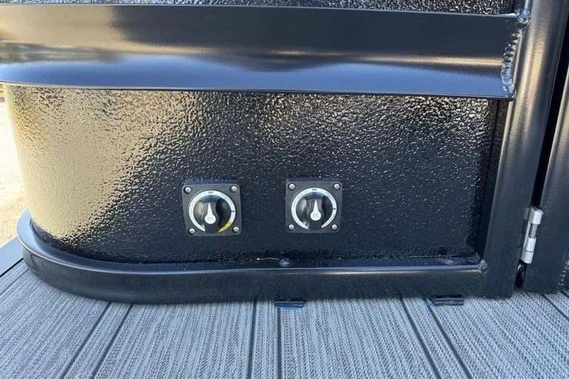 Slide: The Image of Black textured panel with two control knobs on a 2026 Premier 330 Escalante. - 85