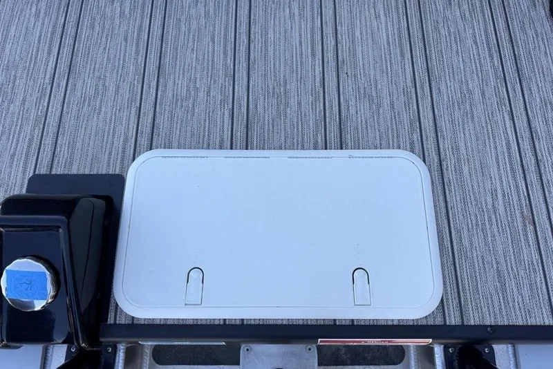 Slide: The Image of Deck hatch on 2026 Premier 330 Escalante boat, featuring textured flooring. - 86