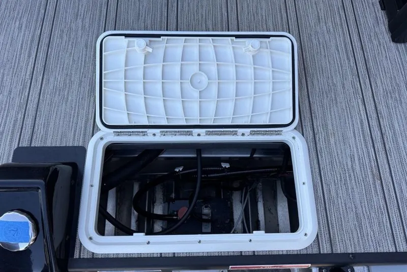 Slide: The Image of Open hatch on 2026 Premier 330 Escalante boat deck, revealing internal components. - 89