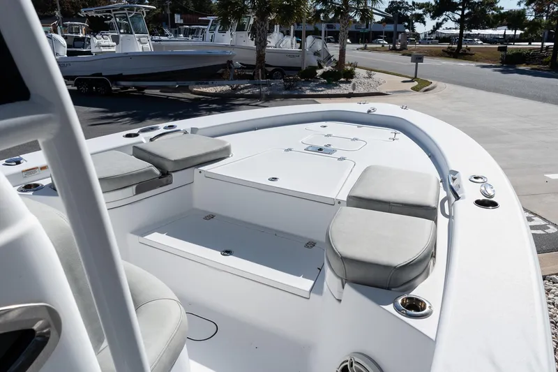 Slide: The Image of 2020 Sportsman Masters 267 Bay Boat with cushioned seating and storage compartments. - 13