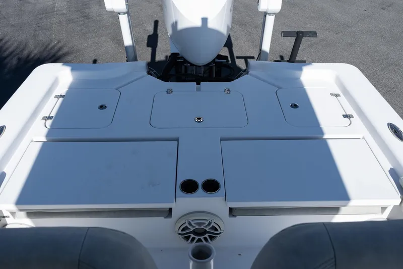 Slide: The Image of 2020 Sportsman Masters 267 Bay Boat deck with storage compartments and cup holders. - 7