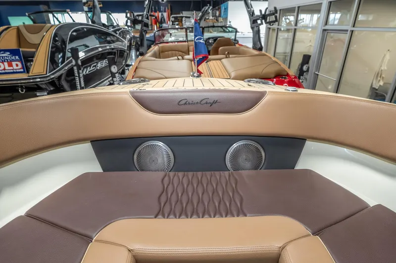 Slide: The Image of 2026 Chris-Craft Sportster 28 interior with luxurious seating and premium audio system. - 24