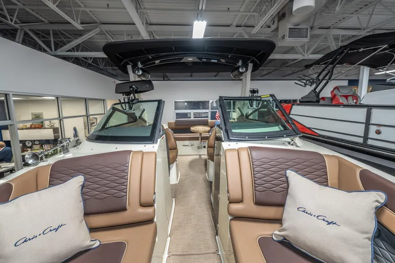 Slide: The Image of 2026 Chris-Craft Sportster 28 boat interior with luxurious seating and elegant design. - 26