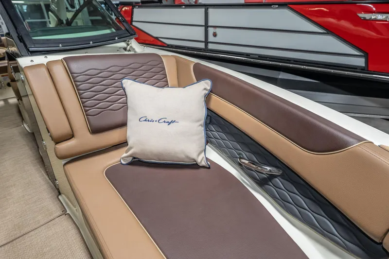 Slide: The Image of 2026 Chris-Craft Sportster 28 interior with luxurious brown leather seating and branded cushion. - 27
