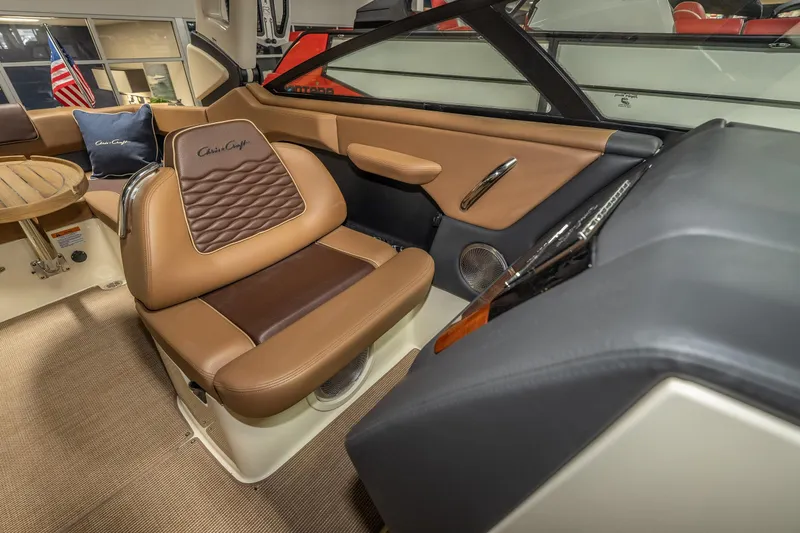 Slide: The Image of Luxurious interior of 2026 Chris-Craft Sportster 28 boat with elegant seating and dashboard. - 29