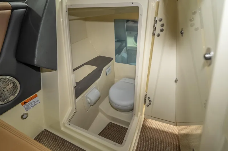 Slide: The Image of 2026 Chris-Craft Sportster 28 boat interior bathroom with toilet and sink. - 32