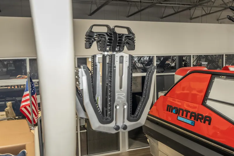 Slide: The Image of Modern boat showroom featuring a 2026 Chris-Craft Sportster 28 and Montara Surf Boss 25. - 33