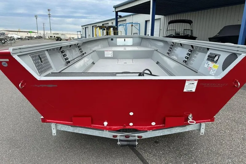Slide: The Image of 2026 Smoker Craft Pro V Sportsman 2072 TL boat, red exterior, parked outdoors. - 3
