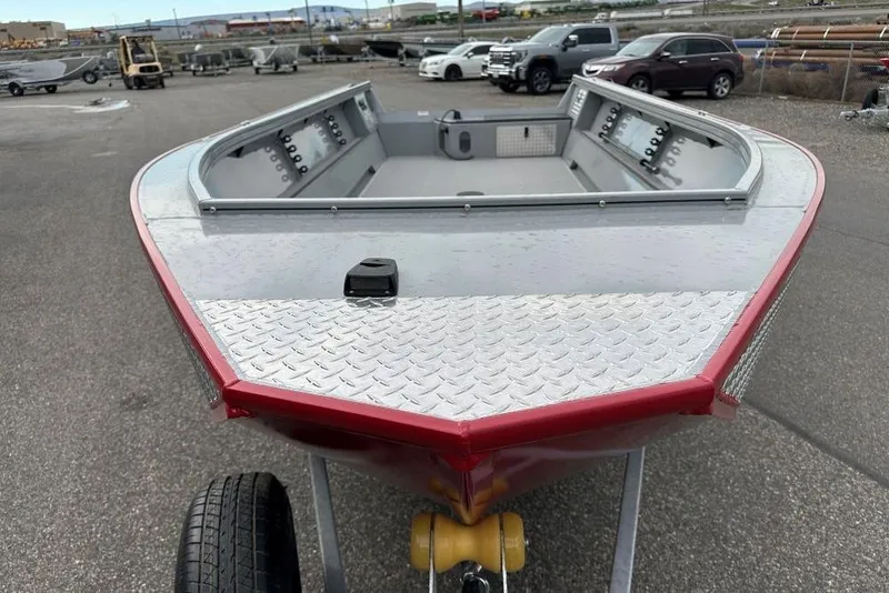 Slide: The Image of 2026 Smoker Craft Pro V Sportsman 2072 TL boat on trailer, parked outdoors. - 4