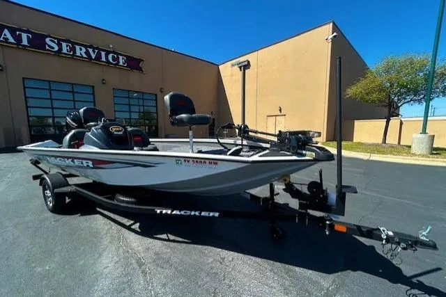 The Image of 2025 Tracker Pro Team 175 TXW boat parked outside a service center. - 1