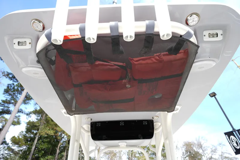 Slide: The Image of 2024 Key West 219 FS boat T-top with life jackets stored in mesh netting. - 10