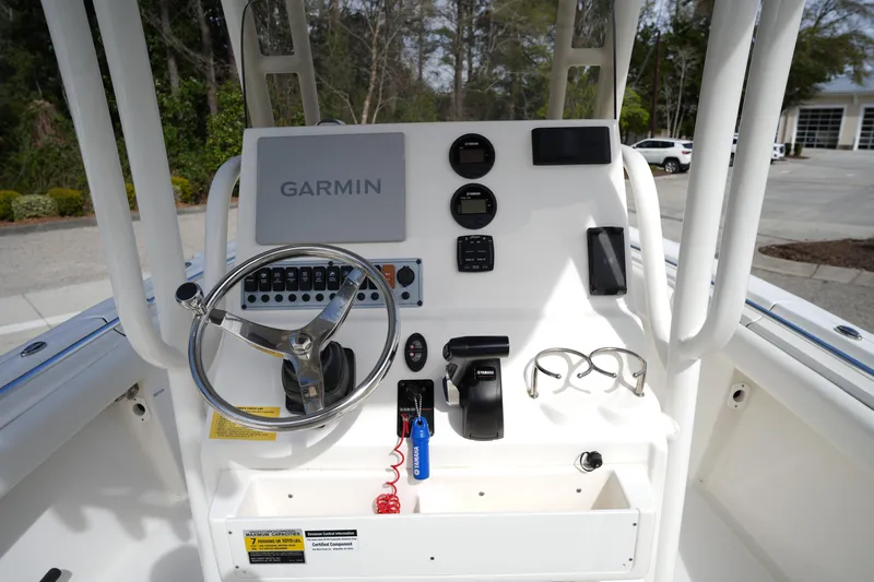 Slide: The Image of 2024 Key West 219 FS boat console with Garmin navigation and Yamaha controls. - 13