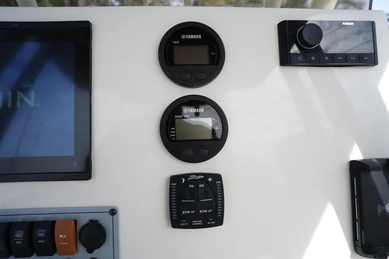 Slide: The Image of Dashboard of 2024 Key West 219 FS boat with Yamaha gauges and controls. - 16