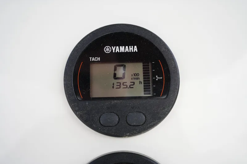 Slide: The Image of Yamaha tachometer displaying 135.2 hours on a 2024 Key West 219 FS boat. - 17