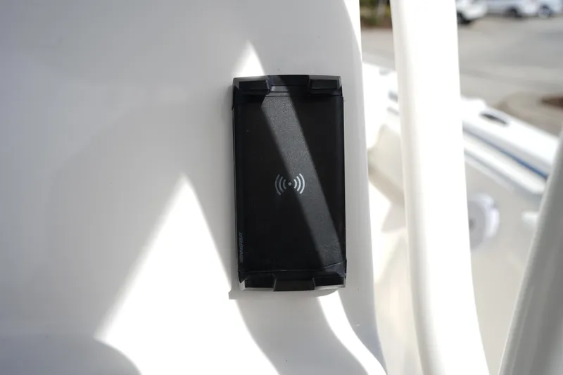 Slide: The Image of Wireless charging pad on 2024 Key West 219 FS boat console. - 18