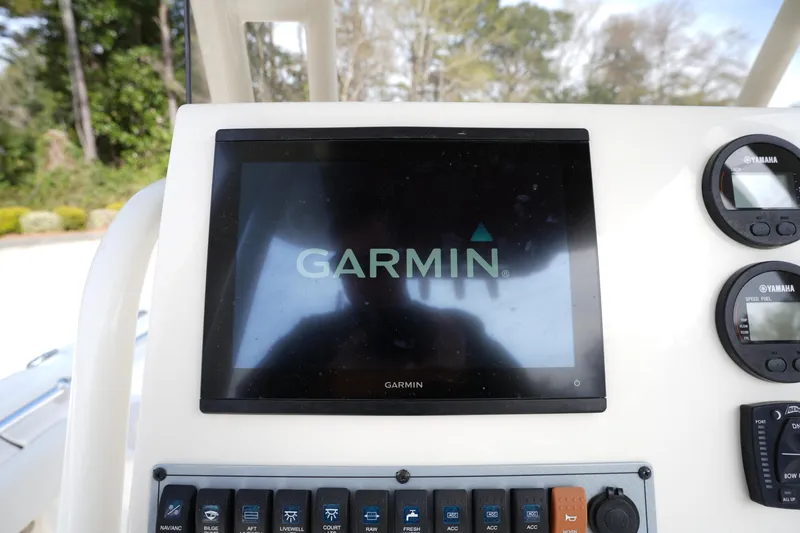 Slide: The Image of Garmin display on 2024 Key West 219 FS boat dashboard with Yamaha gauges. - 19