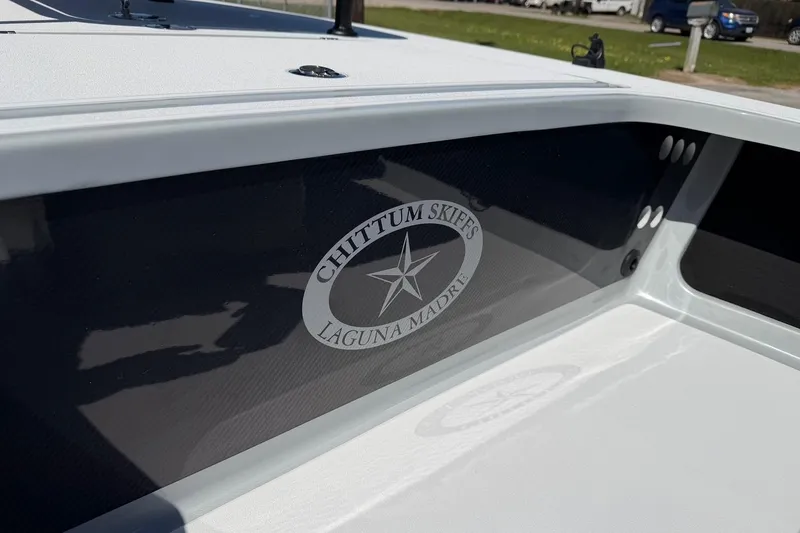 Slide: The Image of 2026 Chittum Skiffs 18 Laguna Madre boat interior with logo detail. - 10
