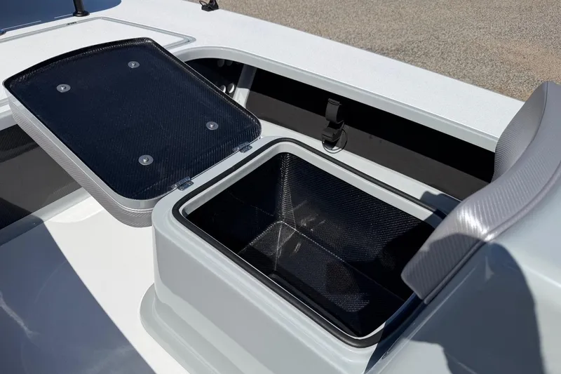 Slide: The Image of Open storage compartment on 2026 Chittum Skiffs 18 Laguna Madre boat. - 12