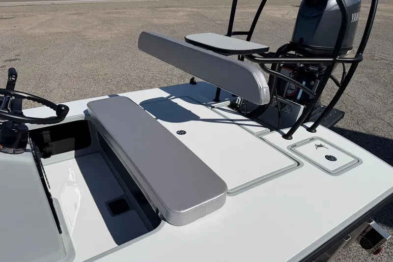 Slide: The Image of 2026 Chittum Skiffs 18 Laguna Madre boat interior with seating and steering wheel. - 13