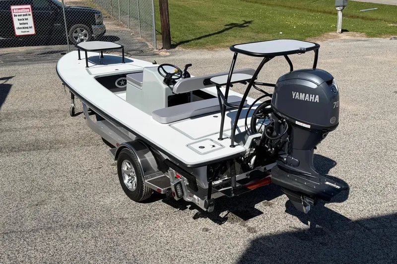 Slide: The Image of 2026 Chittum Skiffs 18 Laguna Madre with Yamaha motor on trailer. - 2