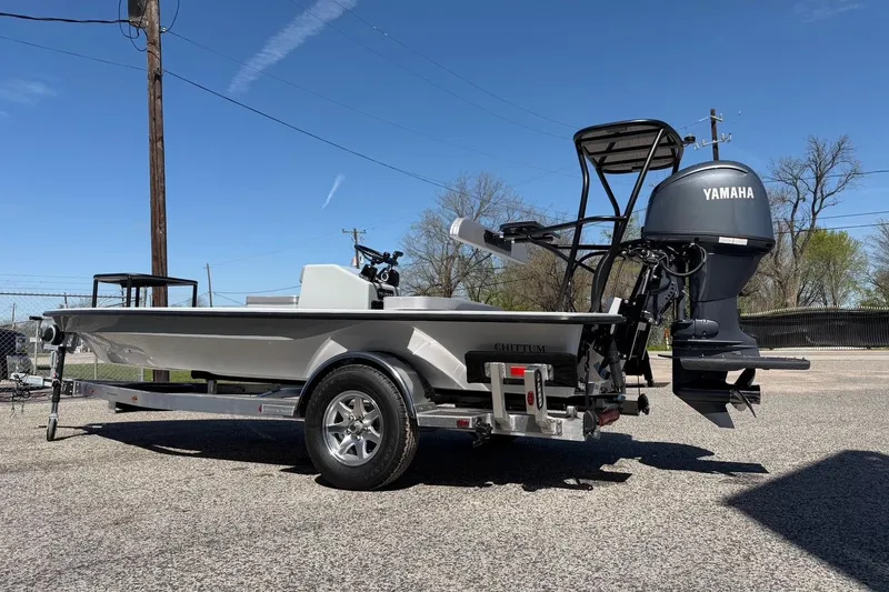 Slide: The Image of 2026 Chittum Skiffs 18 Laguna Madre boat with Yamaha engine on trailer. - 5