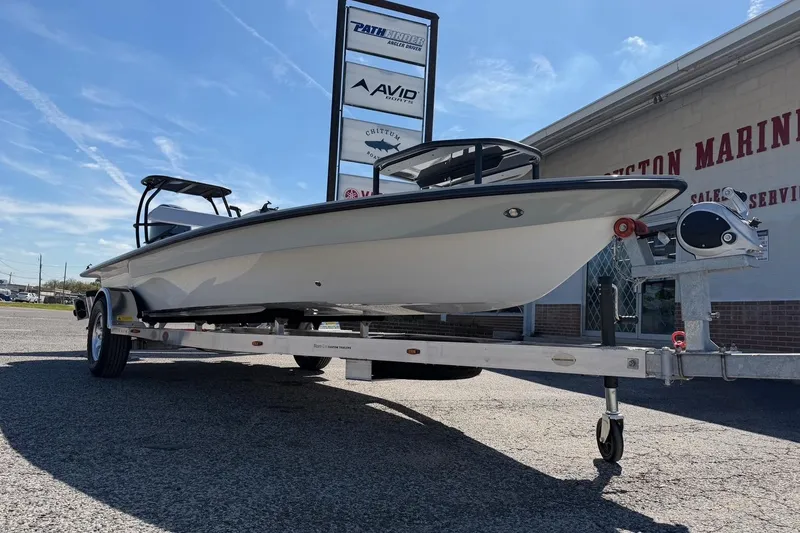 Slide: The Image of 2026 Chittum Skiffs 18 Laguna Madre boat on trailer outside dealership. - 8