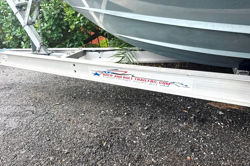 Slide: The Image of Trailer for 2019 Contender 30 ST boat on gravel surface. - 11