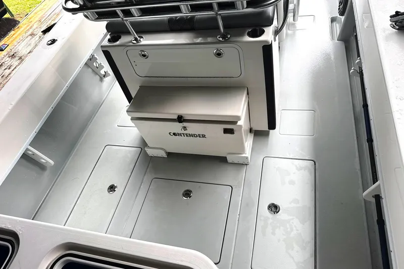 Slide: The Image of 2019 Contender 30 ST boat interior with storage compartments and seating. - 5