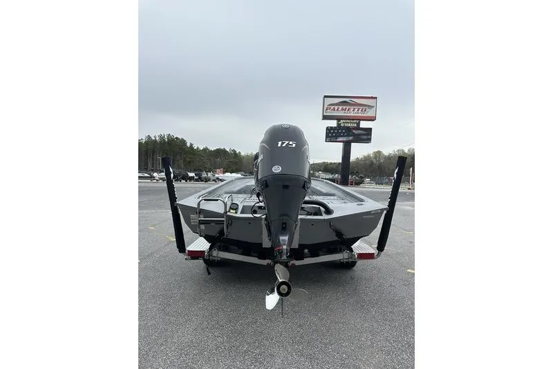 Slide: The Image of 2025 Xpress H22B Bay boat with 175 horsepower engine, parked outdoors. - 4