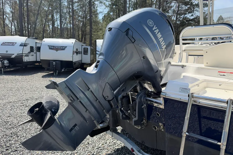 Slide: The Image of 2019 Robalo R200 Center Console with Yamaha outboard motor in a trailer park. - 15