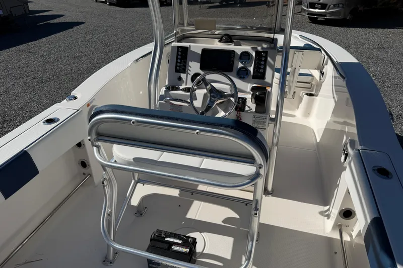 Slide: The Image of 2019 Robalo R200 Center Console boat interior with steering wheel and controls. - 4