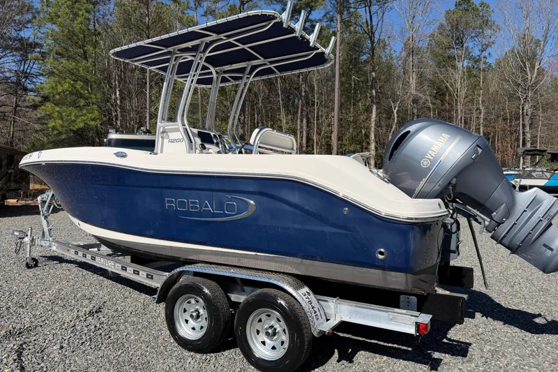 Slide: The Image of 2019 Robalo R200 Center Console boat on trailer, featuring Yamaha outboard motor. - 9