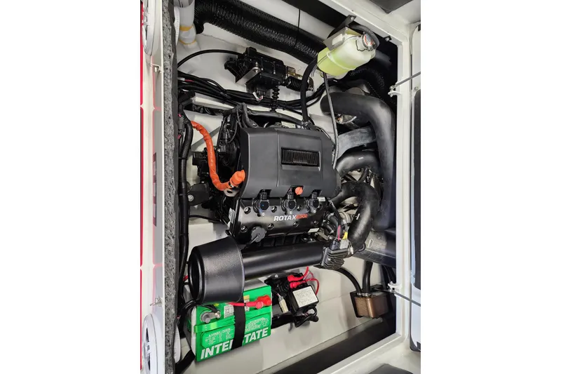 Slide: The Image of Engine compartment of 2026 Highfield Velox 560 with Rotax motor and Interstate battery. - 17